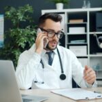 Doctor talking on the phone in his office